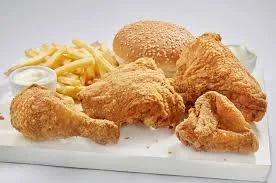 Albaik 4 or 8 piece chicken meal with crispy chicken, fries, bun, and garlic sauce