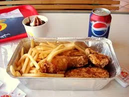  Albaik combo meal with chicken, fries, ice cream and a chilled drink.